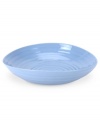 Like a blooming bed of forget-me-nots, this powder-blue porcelain dinnerware has a fresh, natural vibrance. A hand thrown texture gives the contemporary pasta bowl the irresistible charm of traditional pottery.