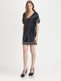 Constructed with luminous beads that form a tribal pattern, this silk v-neck dress has dropped shoulders, short dolman sleeves and a short silhouette. V-neckDropped shouldersShort dolman sleevesAbout 18 from natural waistBeaded silkDry cleanImportedModel shown is 5'10 (177cm) wearing US size Small. Constructed with luminous beads that form a tribal pattern, this silk v-neck dress has dropped shoulders, short dolman sleeves and a short silhouette. V-neckDropped shouldersShort dolman sleevesAbout 18 from natural waistBeaded silkDry cleanImportedModel shown is 5'10 (177cm) wearing US size Small.