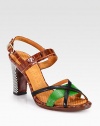 A checkered heel infuses graphic style into this crocodile-print leather sandal, with elegantly crossed straps and bold pops of color. Checker painted wooden heel, 3½ (90mm)Crocodile-print leather and smooth leather upperAdjustable ankle strapLeather lining and solePadded insoleMade in Spain