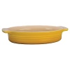 Creuset's stoneware oval dish can be used for baking, serving, marinating or simply storing. Versatile and practical, the stoneware can be used in the oven, broiler or microwave and will not absorb odors or flavors. The durable finish resists chipping, scratching and staining. The bold classic color can go straight from baking to the table making a beautiful tabletop presentation.