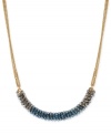 In this frontal necklace from Kenneth Cole New York, faceted beads band together to stunning effect. Crafted from gold- and hematite-tone mixed metal, the necklace makes a bold statement. Approximate length: 16 inches + 3-inch extender. Approximate drop: 3/8 inch.