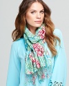 Painterly florals spring from a fringed Lilly Pulitzer scarf for a fresh feminine statement.