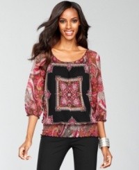 A scarf print and lush colors create an exotic look atop INC's petite peasant blouse. A scarf print and lush colors create an exotic look atop INC's petite peasant blouse.