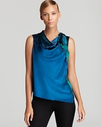 In soft, stretchy silk, Elie Tahari's Ruthie blouse shows off draped and printed details, expertly combined for modern chic. In soft, stretchy silk, Elie Tahari's Ruthie blouse shows off draped and printed details, expertly combined for modern chic.