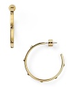 Strong but simple. This pair of gold-plated hoops from Michael Kors are the perfect earrings for everyday - wear them as as shapely showpiece.
