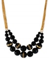 Kenneth Cole New York wants you to have a ball, and look good doing so. This two-row frontal necklace is crafted from gold-tone mixed metal with a number of accented black beads shining through. Approximate length: 16 inches + 3-inch extender. Approximate drop: 2 inches.