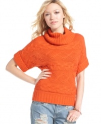 An oversized turtleneck and cable-knit design are fall-ready details that make this sweater a style you'll want to cozy-up to. An oversized turtleneck and cable-knit design are fall-ready details that make this sweater a style you'll want to cozy-up to.