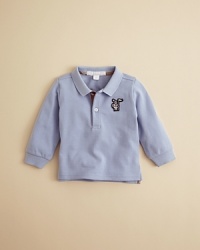 Burberry's soft pique cotton polo is rendered in classic form, with a large embroidered logo at the left chest and check trim inside the placket. Burberry's soft pique cotton polo is rendered in classic form, with a large embroidered logo at the left chest and check trim inside the placket.