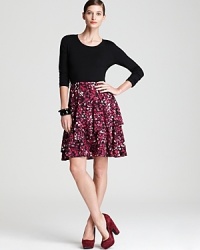 A vibrant print cascades the length of this ruffled DKNY dress for a modern, feminine statement. Simply slip on color-pop pumps and step into the spotlight. A vibrant print cascades the length of this ruffled DKNY dress for a modern, feminine statement. Simply slip on color-pop pumps and step into the spotlight.