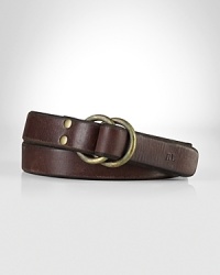 A nod to vintage workwear, this burnished leather belt features an oxidized brass double-ring closure for vintage appeal. A nod to vintage workwear, this burnished leather belt features an oxidized brass double-ring closure for vintage appeal.