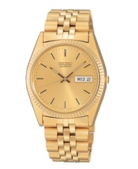 Distinguish yourself with refined taste. Watch by Seiko crafted of gold tone stainless steel bracelet and round case with fluted bezel, 38mm. Gold tone dial features applied stick indices, minute track, day and date window at three o'clock (in English and Spanish), three hands and logo. Quartz movement. Water resistant to 30 meters. Three-year limited warranty. Distinguish yourself with refined taste. Watch by Seiko crafted of gold tone stainless steel bracelet and round case with fluted bezel, 38mm. Gold tone dial features applied stick indices, minute track, day and date window at three o'clock (in English and Spanish), three hands and logo. Quartz movement. Water resistant to 30 meters. Three-year limited warranty.