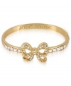 Wrap up your wish list with this adorable hinge bangle bracelet from Betsey Johnson. A bow design is prettied up with crystal accents. Includes signature gift box (4 diameter). Crafted in antique gold tone mixed metal. Approximate diameter: 2-1/3 inches.