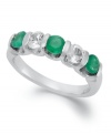 Perfect your look with enviable sparkle. This unique, channel-set ring features round-cut emeralds (3/4 ct. t.w.) and white sapphires (5/8 ct. t.w.) in sterling silver. Size 7.