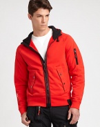 A sporty classic is reinterpreted in soft compact fleece for this vibrant jacket with utility pockets and an attached wind-guard hood.Zip frontAttached drawstring hoodFront slash pocketsZippered pocket at sleeveBanded cuffs and hem72% cotton/28% polyesterMachine washImported