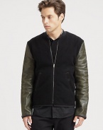 An edgy approach to a prepster favorite, an iconic varsity jacket is rendered in wool fleece with contrasting leather sleeves and pairs easily with your casual wardrobe staples.Zip frontRibbed knit collarWaist slash pocketsAbout 26 from shoulder to hem70% wool/25% nylon/5% cashmereDry cleanImported