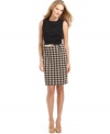 Calvin Klein crafts this petite dress using a supersoft ponte knit and decks the skirt out in a stylish, oversized houndstooth. A matching belt puts the final polish on the look.