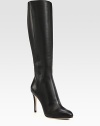 Rich pebble-grain leather forms this tall silhouette resting on a sky-high heel. Self-covered heel, 4 (100mm)Shaft, 16Leg circumference, 13½Leather upperBack zipLeather lining and solePadded insoleMade in Italy