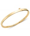 The perfect accessory for your little princess. This smooth bangle features a guard and hinge design in 14k gold. Approximate diameter: 2 inches.