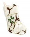 Beautiful from heel to toe, the Holiday Nouveau Christmas stocking is a gift in itself. A classic holly and ribbon motif is trimmed in glittery gold and full of holiday grace.