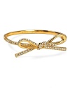 A prim and proper bow tops this kate spade new york bangle, splashed with glamorous crystal stations.