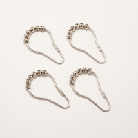 Embellished with beads, these metal hooks complement classic bathroom decor. Embellished with beads, these metal hooks complement classic bathroom decor.