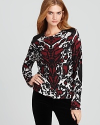 Following the continuing fascination with animal prints, big and small, this Sam & Lavi sweater is perfectly on-trend for fall in the ultimate color trifecta. Following the continuing fascination with animal prints, big and small, this Sam & Lavi sweater is perfectly on-trend for fall in the ultimate color trifecta.