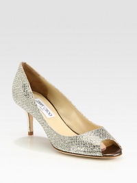 Instantly chic peep toe pump crafted of glitter fabric with a mesh stitched overlay. Textured metallic leather heel, 2¾ (70mm)Glitter-coated fabric upperPeep toeLeather lining and solePadded insoleMade in Italy
