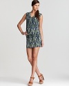 Cool tones stretch from cowl neckline to high hemline on this MICHAEL Michael Kors dress, abundant with a vibrant tribal print. Accentuate the exotic element with strappy leather sandals.