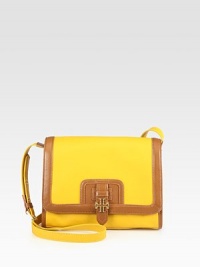 A bright addition to any look, this leather accented coated canvas style features a long adjustable strap for a crossbody design.Adjustable shoulder strap, 18½ to 21 dropMagnetic flap closureOne open outside pocketOne inside zip pocketTwo inside open pocketsCanvas lining10½W X 8H X 3DImported A bright addition to any look, this leather accented coated canvas style features a long adjustable strap for a crossbody design.Adjustable shoulder strap, 18½ to 21 dropMagnetic flap closureOne open outside pocketOne inside zip pocketTwo inside open pocketsCanvas lining10½W X 8H X 3DImported
