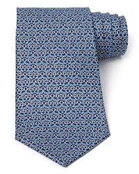 Intricately patterned with a host of Gancini logos, this robust tie from Salvatore Ferragamo finishes your professional ensemble with top-notch quality. Intricately patterned with a host of Gancini logos, this robust tie from Salvatore Ferragamo finishes your professional ensemble with top-notch quality.