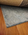 Stop your rug from slipping! No matter where you want to place your area rug, this reversible rug pad easily flips for use on either hard or soft surfaces with its dual-sided construction. Its thickness also works on uneven surfaces, like tile or concrete, to keep your rug even and firmly held in its place.