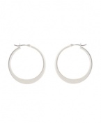 Shimmery hoops with a modern spin. Kenneth Cole New York earrings feature a graduated hoop in silver tone mixed metal. Approximate diameter: 1-1/4 inches.