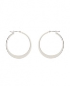 Shimmery hoops with a modern spin. Kenneth Cole New York earrings feature a graduated hoop in silver tone mixed metal. Approximate diameter: 1-1/4 inches.