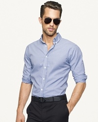 Handsome gingham checks lend graphic appeal to a trim-fitting sport shirt, designed in smooth woven cotton for a luxurious look and feel. Handsome gingham checks lend graphic appeal to a trim-fitting sport shirt, designed in smooth woven cotton for a luxurious look and feel.