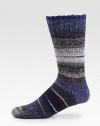 A thick wool blend, in soft, multicolored stripes is an ideal choice to wear under your winter boots for all day comfort.Mid-calf height52% wool/46% acrylic/1% elastane/1% polyamideMachine washImported