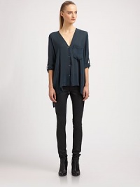 Nothing short of elegant, this featherweight shirt is designed with roll-tab sleeves and an asymmetrical cropped front hem. V-neckRoll-tab sleevesButton frontSingle front patch pocketAsymmetrical cropped front hemViscoseDry cleanImportedSIZE & FITModel shown is 5'10 (177cm) wearing US size Small. 