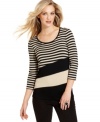 This top from Cable & Gauge makes a bold statement with classic stripes and colorblocking at the hem. Pair it with skinny pants for a no-fuss ensemble.