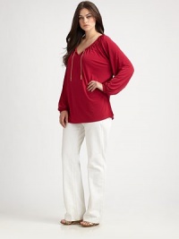 Flattering and feminine, this tunic features an elasticized neckline and cuffs. Its relaxed fit and unique chain detail will make this design one of your favorites.Self-tie v-necklineDolman sleevesGathered details at backPull-on styleAbout 30 from shoulder to hem95% polyester/5% spandexMachine washImported Flattering and feminine, this tunic features an elasticized neckline and cuffs. Its relaxed fit and unique chain detail will make this design one of your favorites.Self-tie v-necklineDolman sleevesGathered details at backPull-on styleAbout 30 from shoulder to hem95% polyester/5% spandexMachine washImported