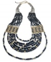 The gorgeous combination of black and gold rains down on this long multi-strand necklace from Style& co. With glass, metal and wooden beads. Crafted in antiqued gold tone mixed metal. Approximate length: 30 inches + 3-inch extender.
