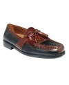 One of the most versatile options for everyday wear, this pair of kilted, tasseled men's loafers goes with just about anything from khakis to corduroys. A tumbled leather upper with contrast trim and stitching makes these men's dress shoes stand out. Leather/rubber outsole. Imported.
