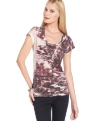 Calvin Klein Jeans' cotton-blend tee features a bold print and easy fit - perfect for the weekend and beyond!