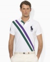 Designed exclusively for Ralph Lauren's collection celebrating the Wimbledon Championships, a classic short-sleeved polo shirt is tailored for a trim, modern fit from breathable cotton mesh with preppy diagonal sash stripes.