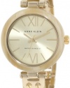 Anne Klein Women's 109652CHHN Gold-Tone Horn Plastic Bezel and Bangle Bracelet Watch