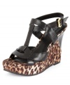 Luxe fabric give the thick straps of GUESS' Yakima wedge platform sandals a sultry feel that puts this sexy pair heads and shoulders above the rest. (Clearance)
