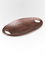 A striking tray in antique copper-plated alloy features the slight irregularities that define handcrafted accents such as these. And with small handles on the sides, it's as convenient as it is elegant. From the Heritage Pebble CollectionAntique copper-plated alloy18W X 10LWipe cleanImported