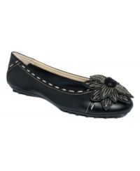Graceful and pirouette-approved: The Twiggy 2 ballet flats from Adrienne Vittadini flaunt threaded trim detailing and a fanciful floral accent for feminine charm. Graceful and pirouette-approved: The Twiggy 2 ballet flats from Adrienne Vittadini flaunt threaded trim detailing and a fanciful floral accent for feminine charm.