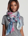 An abstract geometric print in gray, pink and blue dances across this super-soft scarf from Emilio Pucci.