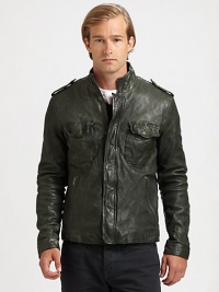 Washed leather jacket embodies a military-inspired look with shoulder epaulettes, in addition to a chest flap, zippered side pockets and a snap-button placket for maximum style and versatility.Zip frontStand collarShoulder epaulettesChest flap, zippered waist slash pocketsAbout 26 from shoulder to hemLeatherDry cleanImported
