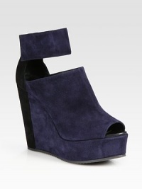 Held in place by a wide, Velcro® strap, this soft suede mule has a contrasting back, towering wedge and covered platform. Self-covered wedge, 4½ (115mm)Covered platform, 1½ (40mm)Compares to a 3 heel (75mm)Suede upperLeather liningRubber solePadded insoleMade in Italy Held in place by a wide, Velcro® strap, this soft suede mule has a contrasting back, towering wedge and covered platform. Self-covered wedge, 4½ (115mm)Covered platform, 1½ (40mm)Compares to a 3 heel (75mm)Suede upperLeather liningRubber solePadded insoleMade in Italy