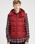 A warm, quilted silhouette and a removable drawstring hood adds a city-cool look to this military-inspired down vest for a relaxed, refined style that will remain season after season.Two-way frontRemovable drawstring hoodSide zip pocketsAbout 26 from shoulder to hemNylonDry cleanImported